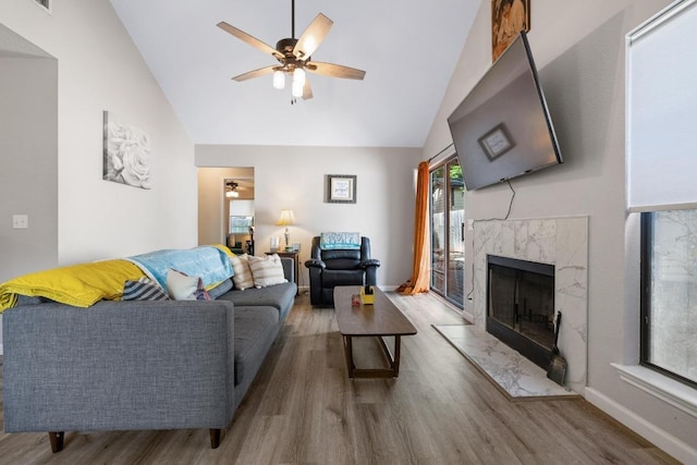 1821 Golden Pheasant Dr, Austin, TX 78758 - living area with wood finished floors, high vaulted ceiling, a ceiling fan, and a premium fireplace