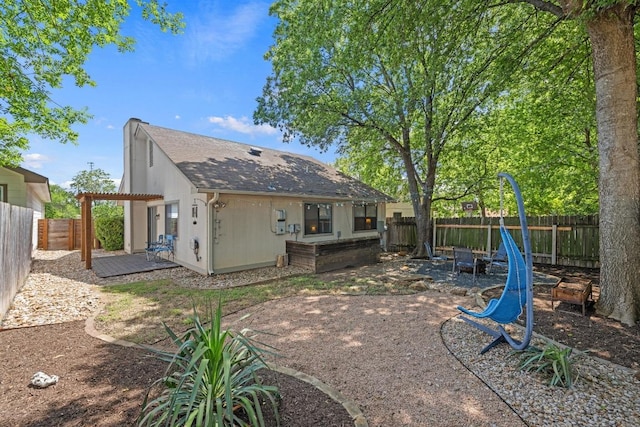 1821 Golden Pheasant Dr, Austin, TX 78758 - back of house with a fenced backyard, a patio, a pergola, and roof with shingles