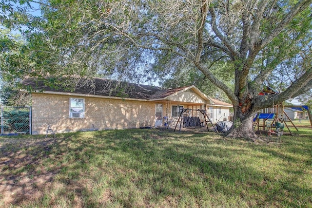 1402 Herder Ave, Schulenburg, TX 78956 - rear view of house with brick siding