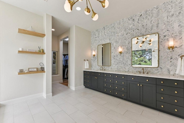 1108 Lakewood Hills Ter, Austin, TX 78732 - bathroom with double vanity, a chandelier, wallpapered walls, a spacious closet, and tile patterned floors