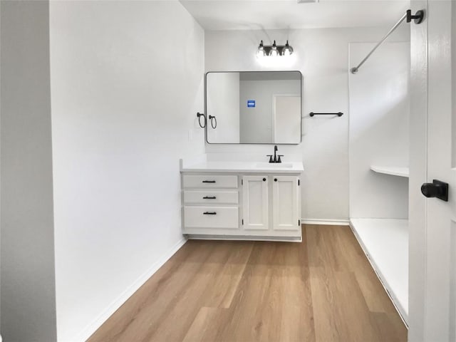 1207 Brashear Ln, Cedar Park, TX 78613 - full bath with wood finished floors, a walk in shower, and vanity