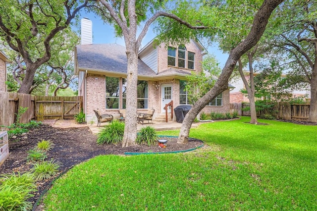 1406 Hunter Ace Way, Cedar Park, TX 78613 - rear view of property with brick siding, a patio area, a fenced backyard, entry steps, and a chimney