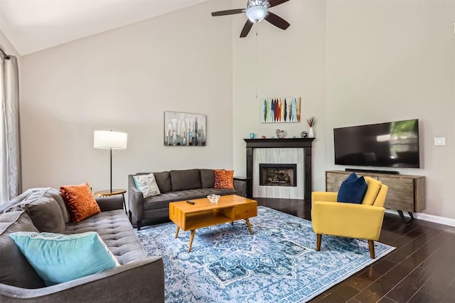1406 Hunter Ace Way, Cedar Park, TX 78613 - living area with a ceiling fan, dark wood finished floors, high vaulted ceiling, and a tile fireplace