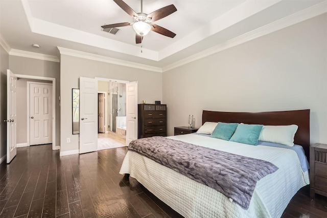 1406 Hunter Ace Way, Cedar Park, TX 78613 - bedroom featuring a raised ceiling, dark wood-style floors, crown molding, ceiling fan, and connected bathroom
