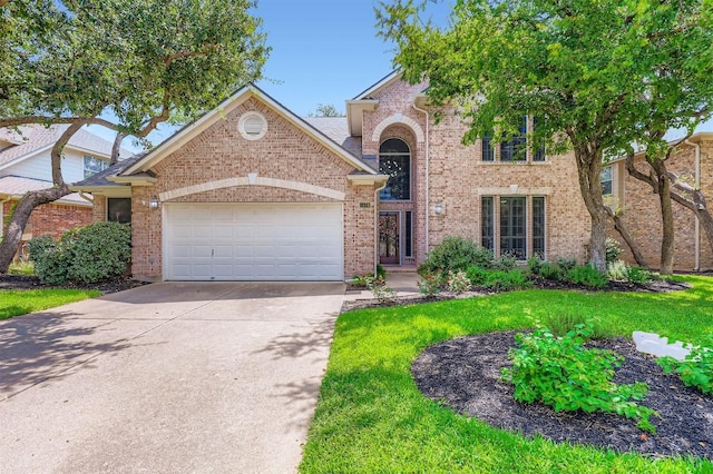 1406 Hunter Ace Way, Cedar Park, TX 78613 - traditional home featuring an attached garage, driveway, brick siding, and a front lawn