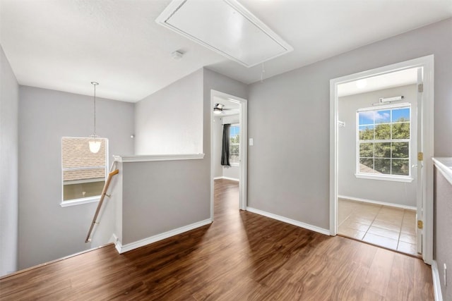 8701 Meridian Oak Ln, Austin, TX 78744 - empty room featuring attic access and wood finished floors