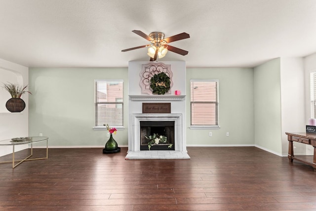 425 Starview St, Temple, TX 76502 - unfurnished living room with ceiling fan, a fireplace with raised hearth, and hardwood / wood-style flooring
