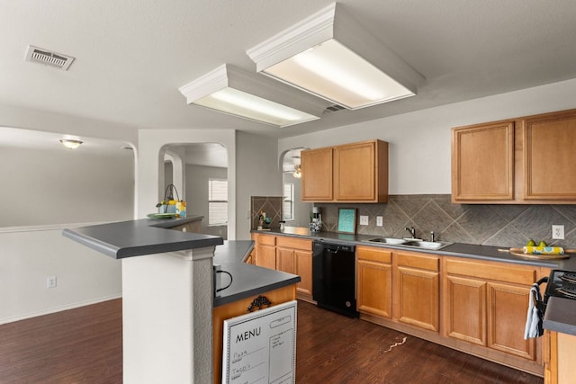 425 Starview St, Temple, TX 76502 - kitchen featuring black appliances, dark countertops, tasteful backsplash, and dark wood-style floors