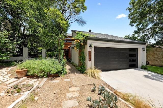 6110 Gardenridge Holw, Austin, TX 78750 - view of front facade featuring concrete driveway, a garage, and stucco siding