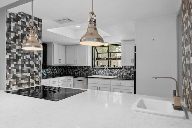 6110 Gardenridge Holw, Austin, TX 78750 - kitchen featuring black electric stovetop, backsplash, dishwasher, and white cabinetry