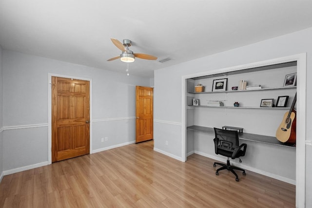 6110 Gardenridge Holw, Austin, TX 78750 - office area with light wood-style flooring, built in desk, and a ceiling fan