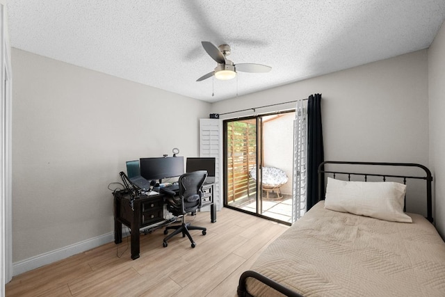 6110 Gardenridge Holw, Austin, TX 78750 - bedroom with light wood-style floors, access to outside, an office area, a textured ceiling, and ceiling fan