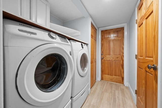 6110 Gardenridge Holw, Austin, TX 78750 - laundry area featuring washing machine and dryer and light wood-style flooring