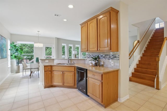 6520 Walebridge Ln, Austin, TX 78739 - kitchen with dishwasher, a peninsula, light tile patterned flooring, tasteful backsplash, and recessed lighting