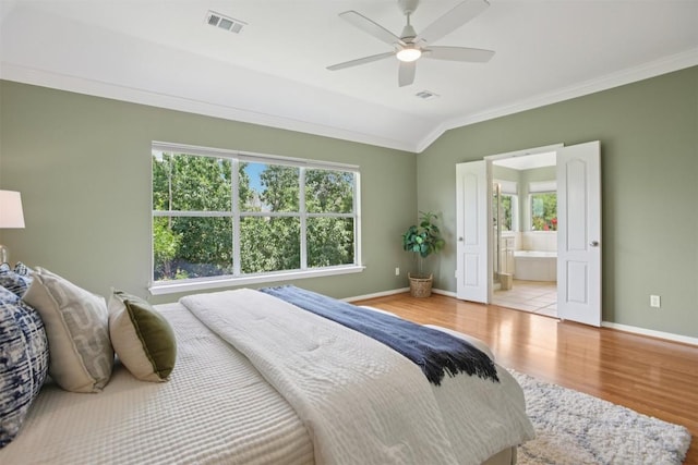 6520 Walebridge Ln, Austin, TX 78739 - bedroom featuring ornamental molding, wood finished floors, vaulted ceiling, ensuite bathroom, and ceiling fan