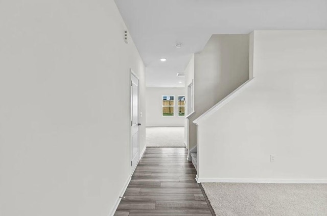 127 Bridgeview Dr, Hutto, TX 78634 - hall featuring stairs, recessed lighting, dark carpet, and dark wood-style floors