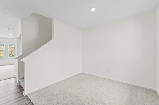 127 Bridgeview Dr, Hutto, TX 78634 - empty room with stairs, carpet floors, a smoke detector, and recessed lighting
