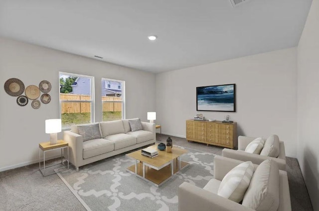 127 Bridgeview Dr, Hutto, TX 78634 - carpeted living area featuring baseboards