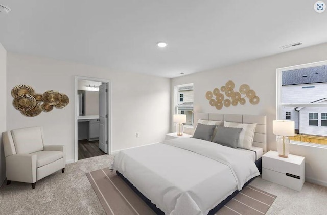 127 Bridgeview Dr, Hutto, TX 78634 - bedroom featuring carpet flooring, recessed lighting, and ensuite bath
