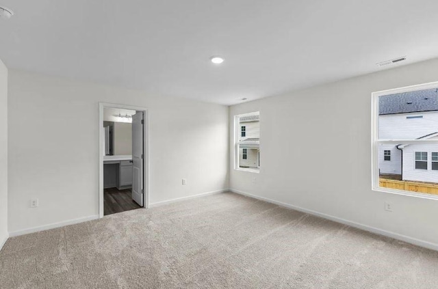 127 Bridgeview Dr, Hutto, TX 78634 - carpeted spare room featuring baseboards and recessed lighting