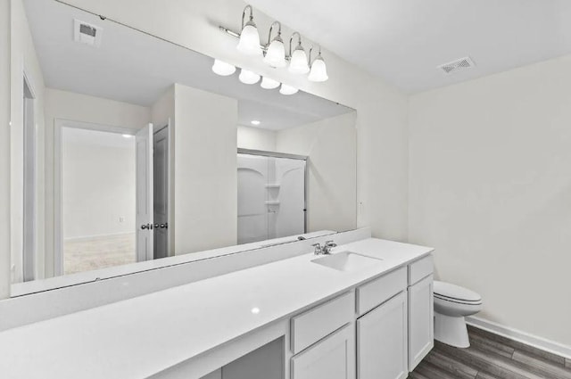 127 Bridgeview Dr, Hutto, TX 78634 - full bath featuring wood finished floors, vanity, and a shower