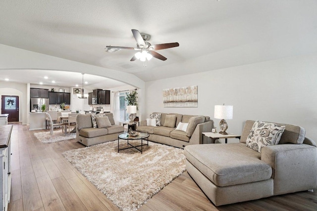 184 Pivot Dr, Taylor, TX 76574 - living room featuring arched walkways, a ceiling fan, recessed lighting, and wood finished floors