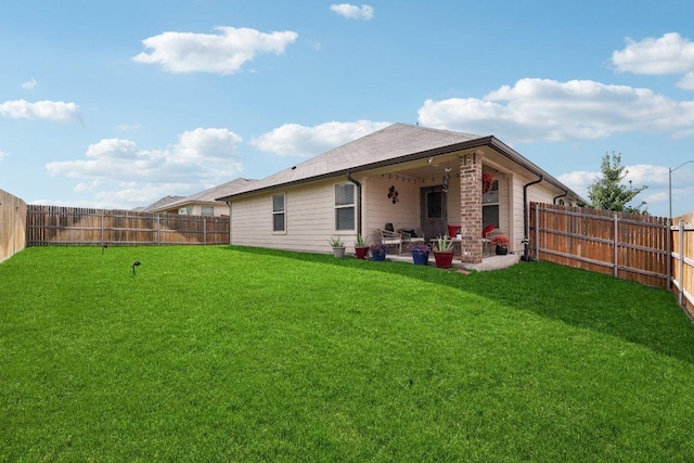184 Pivot Dr, Taylor, TX 76574 - rear view of house with a fenced backyard and a patio area