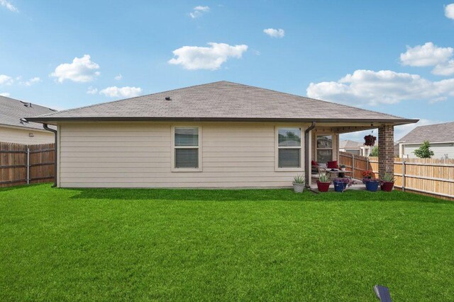 184 Pivot Dr, Taylor, TX 76574 - rear view of property featuring a fenced backyard and roof with shingles