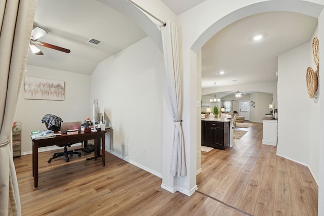 184 Pivot Dr, Taylor, TX 76574 - office space with arched walkways, ceiling fan, and light wood-style flooring