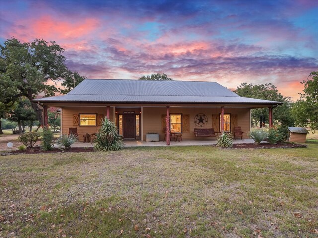 762 Karisch Rd, Giddings, TX 78942 - farmhouse-style home with a porch and a front yard