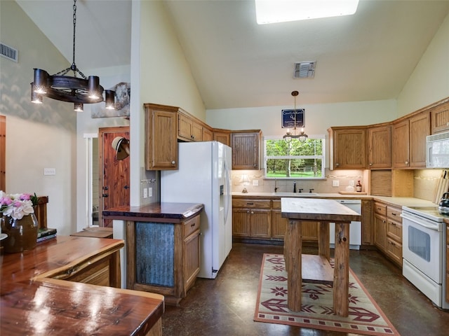 762 Karisch Rd, Giddings, TX 78942 - kitchen featuring white appliances, backsplash, wood counters, hanging light fixtures, and high vaulted ceiling