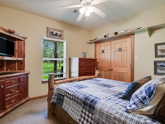 762 Karisch Rd, Giddings, TX 78942 - bedroom featuring light colored carpet, a closet, and ceiling fan