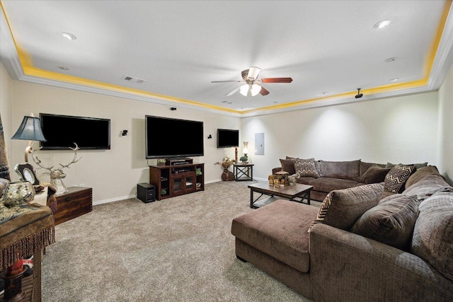 515 Wesley Ridge Dr, Spicewood, TX 78669 - carpeted living room with a tray ceiling, a ceiling fan, ornamental molding, and electric panel