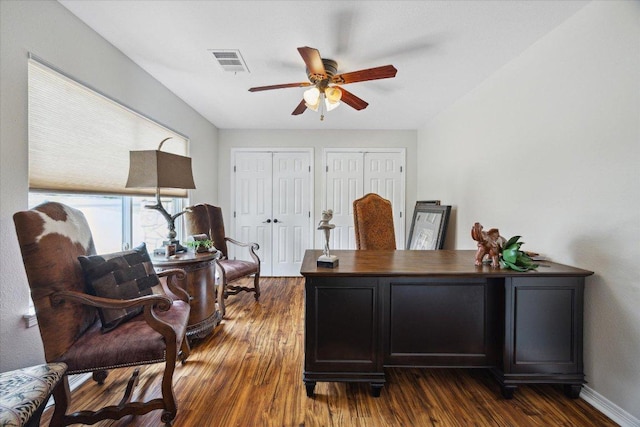 515 Wesley Ridge Dr, Spicewood, TX 78669 - home office featuring a ceiling fan and dark wood-type flooring