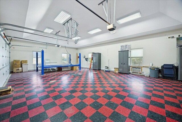 515 Wesley Ridge Dr, Spicewood, TX 78669 - garage with a garage door opener and baseboards