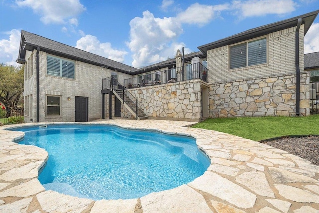515 Wesley Ridge Dr, Spicewood, TX 78669 - swimming pool featuring stairs and a wooden deck