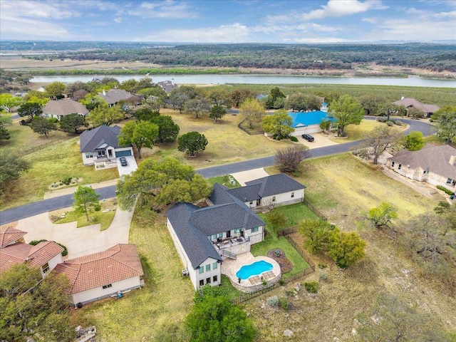 515 Wesley Ridge Dr, Spicewood, TX 78669 - aerial view of residential area with a large body of water and a pool area