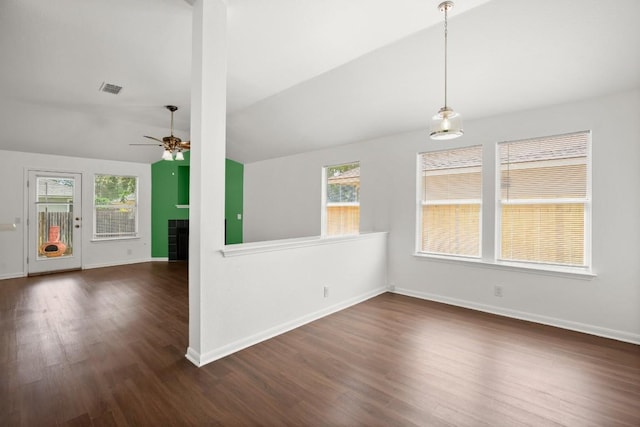14608 Menifee St, Austin, TX 78725 - empty room with a ceiling fan, vaulted ceiling, dark wood-style floors, and a fireplace