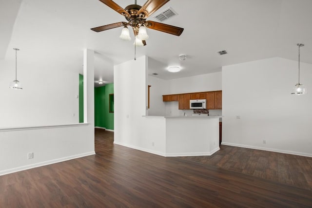 14608 Menifee St, Austin, TX 78725 - unfurnished living room with ceiling fan and dark wood-type flooring