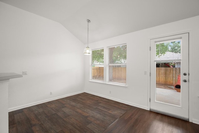 14608 Menifee St, Austin, TX 78725 - unfurnished dining area with dark wood-style floors and lofted ceiling