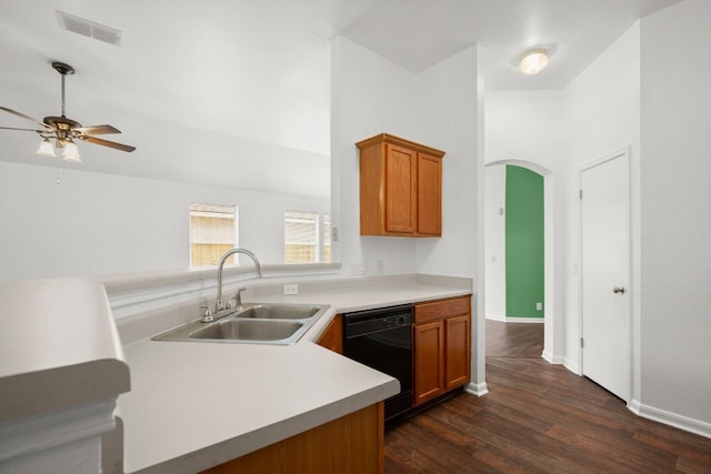 14608 Menifee St, Austin, TX 78725 - kitchen with black dishwasher, ceiling fan, dark wood finished floors, and brown cabinets