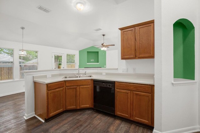 14608 Menifee St, Austin, TX 78725 - kitchen featuring black dishwasher, a peninsula, dark wood-style flooring, brown cabinets, and lofted ceiling