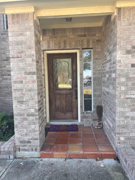4522 Heritage Well Ln, Round Rock, TX 78665 - view of exterior entry featuring brick siding