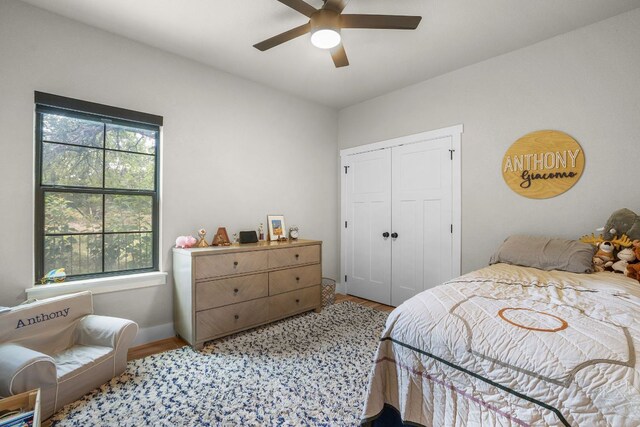 809 John Price, Blanco, TX 78606 - bedroom featuring light wood-type flooring, a closet, and ceiling fan