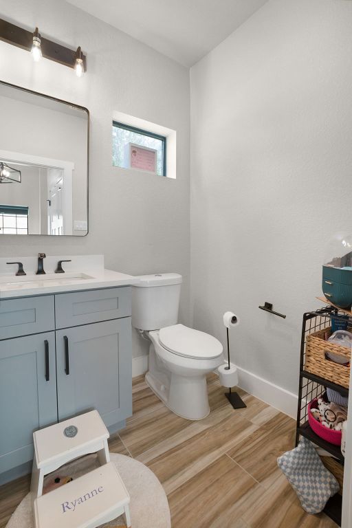 809 John Price, Blanco, TX 78606 - bathroom featuring wood finished floors and vanity