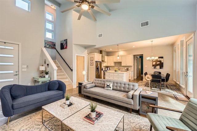 14708 Longbranch Dr, Austin, TX 78734 - living room with ceiling fan, high vaulted ceiling, stairway, a chandelier, and beam ceiling