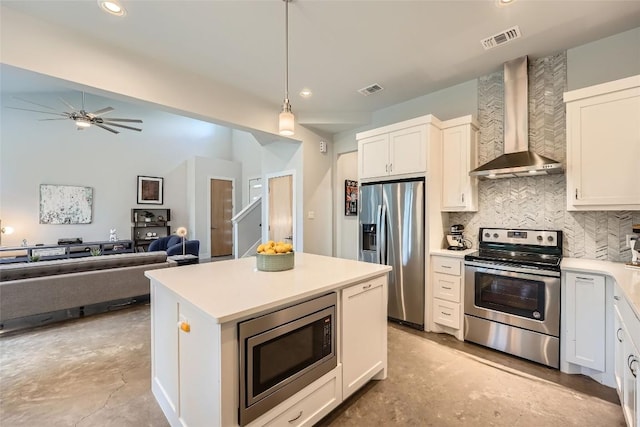 14708 Longbranch Dr, Austin, TX 78734 - kitchen with appliances with stainless steel finishes, wall chimney exhaust hood, unfinished concrete flooring, decorative backsplash, and recessed lighting