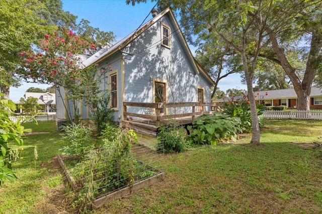 710 Gresham St, Smithville, TX 78957 - back of property featuring a wooden deck