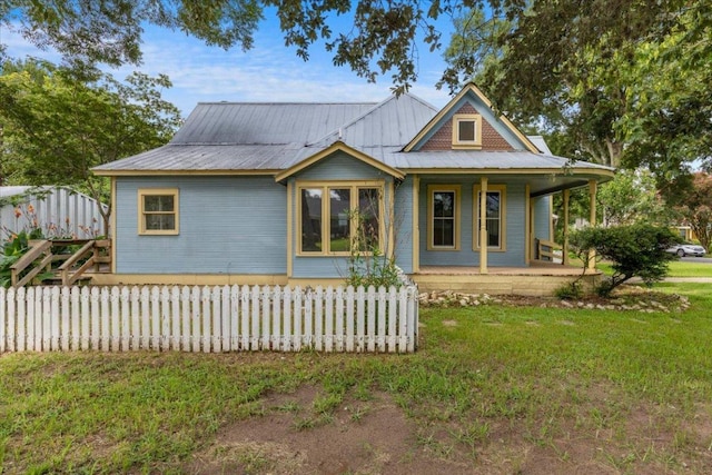 710 Gresham St, Smithville, TX 78957 - view of front of house featuring a porch and a metal roof