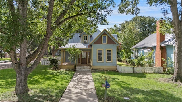 710 Gresham St, Smithville, TX 78957 - view of front of home featuring a porch and a metal roof